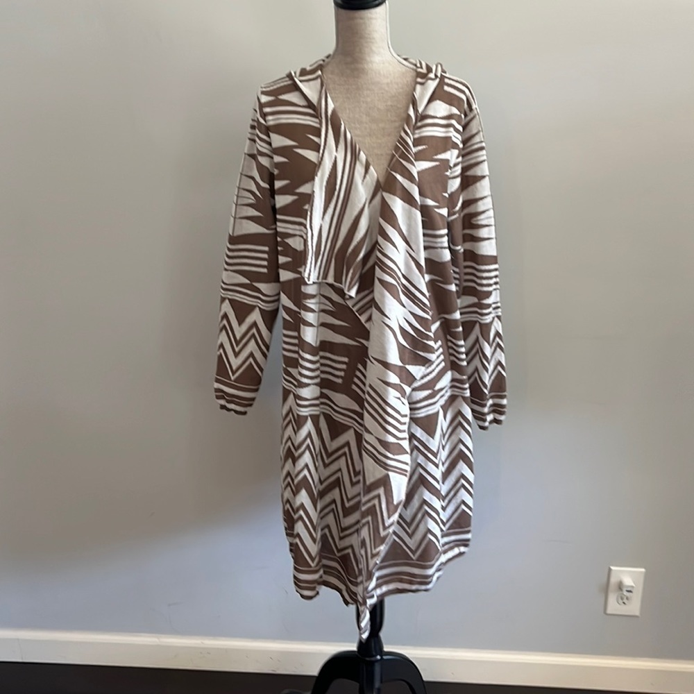 Brittany Black size XL hooded shrug in cream and tan colors.